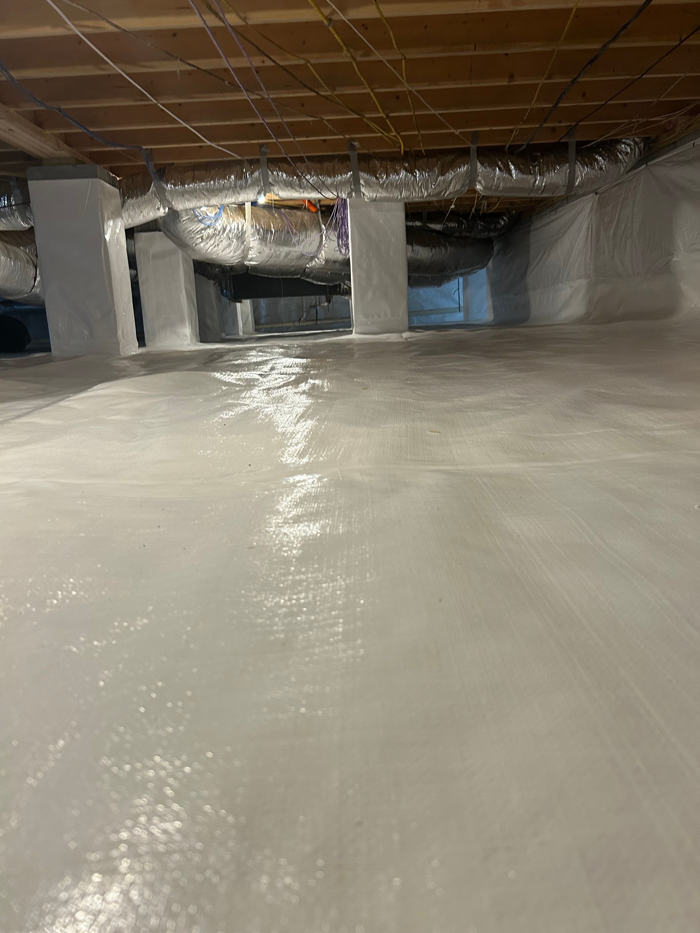 Crawl space with insulation and ductwork